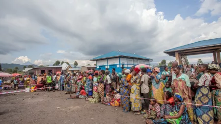 Internally Displaced People wait their turn at a dignity kit distribution in Mudja, Goma