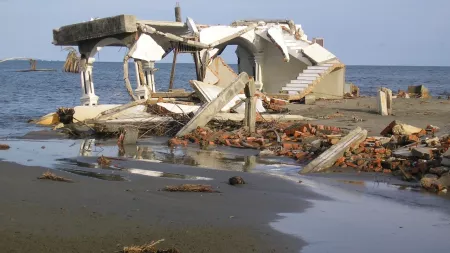 Destroyed house by the beach