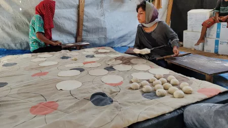 displaced women in Gaza making bread to feed their families and earn a small income