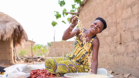 Akossiwa, a farmer and foodseller from Togo, with her maize harvest