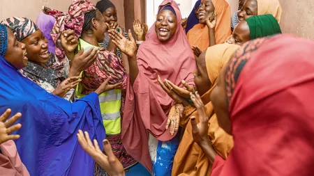 Adolescent girl in Nguru playing and dancing at the safe space for women and girls.