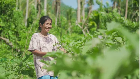 A woman farmer tends to her vegetable garden in Catanduanes.