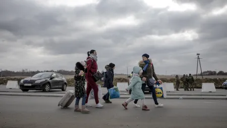 Displaced Ukrainians cross the Polish border by foot, in Medyka, on the Ukraine-Poland border