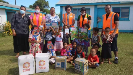 Emergency aid distribution following a volcanic eruption, with CARE’s partners Thalita and MORDI.