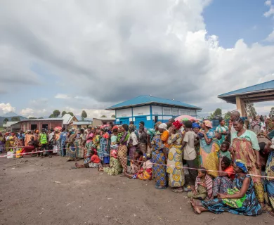 Internally Displaced People wait their turn at a dignity kit distribution in Mudja, Goma
