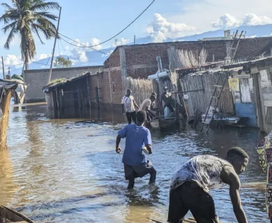 Burundi flood victims wade through submerged village near Lake Tanganyika.