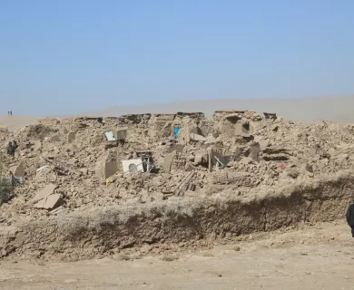 Rubble in deserted area with man standing on the right side