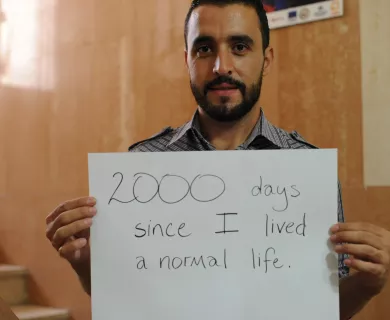 Syrian refugee Mohammed taking part in a 2016 campaign marking 2000 days since the conflict started 