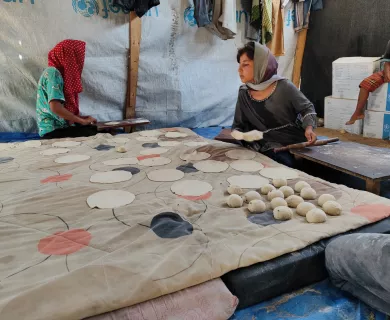 displaced women in Gaza making bread to feed their families and earn a small income